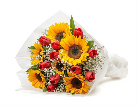 Bouquet of sunflowers and red tulips in white paper packaging on a white background