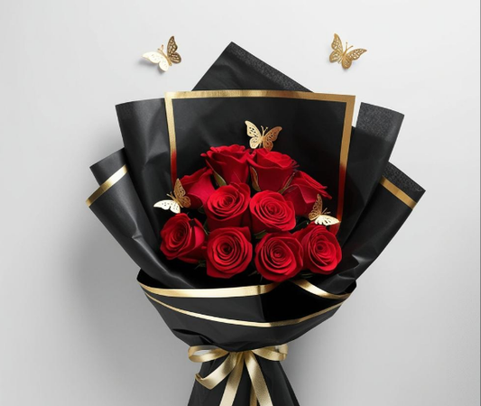 A bouquet of red roses wrapped in black and gold-colored, gold-plated sheets with butterfly decorations.