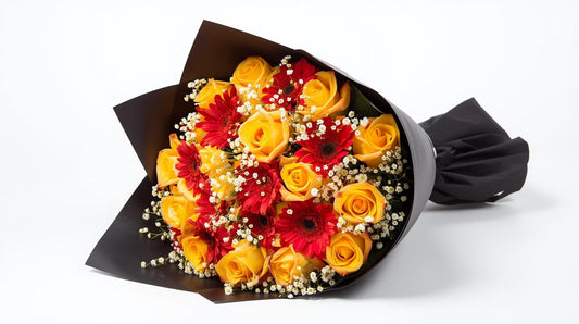 Bouquet of yellow and red flowers wrapped in black paper on a white background