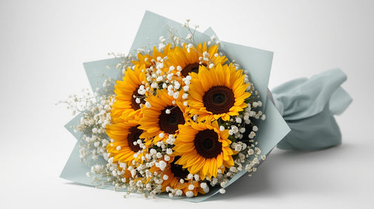 Bouquet of sunflowers with small white flowers on light gray background